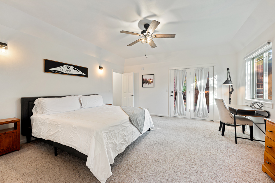 Cozy master bedroom featuring a walk-in closet and natural light.